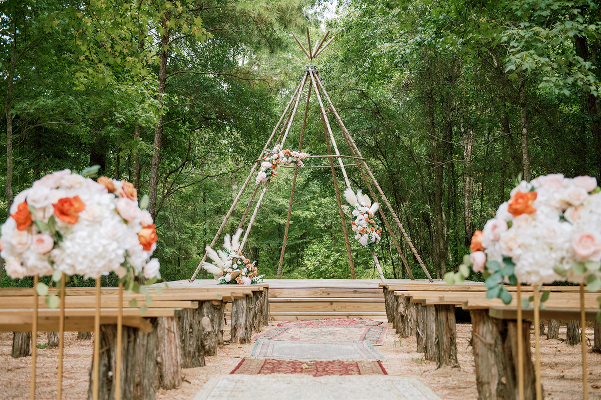 Tipi Wedding Floral Decor in Orange and green at The Shires