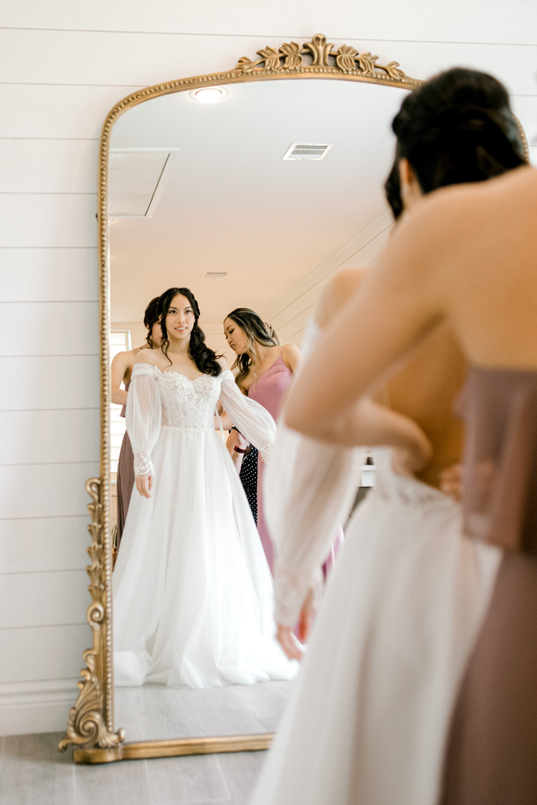 Bride getting dressed in Bridgerton inspired wedding dress by Houston Photographer Mercie B Studio