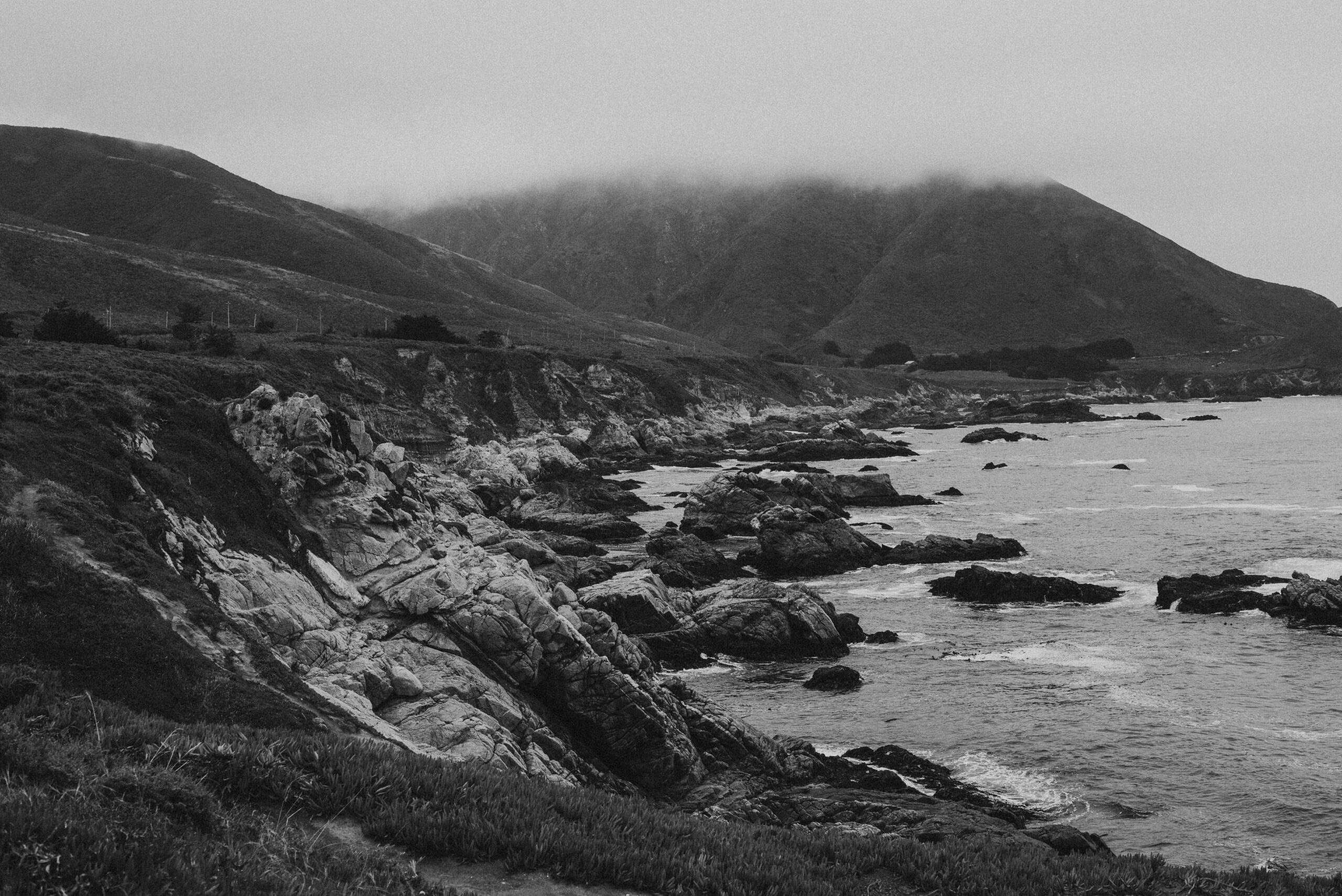 Black and white photograph of the Big Sur coastline